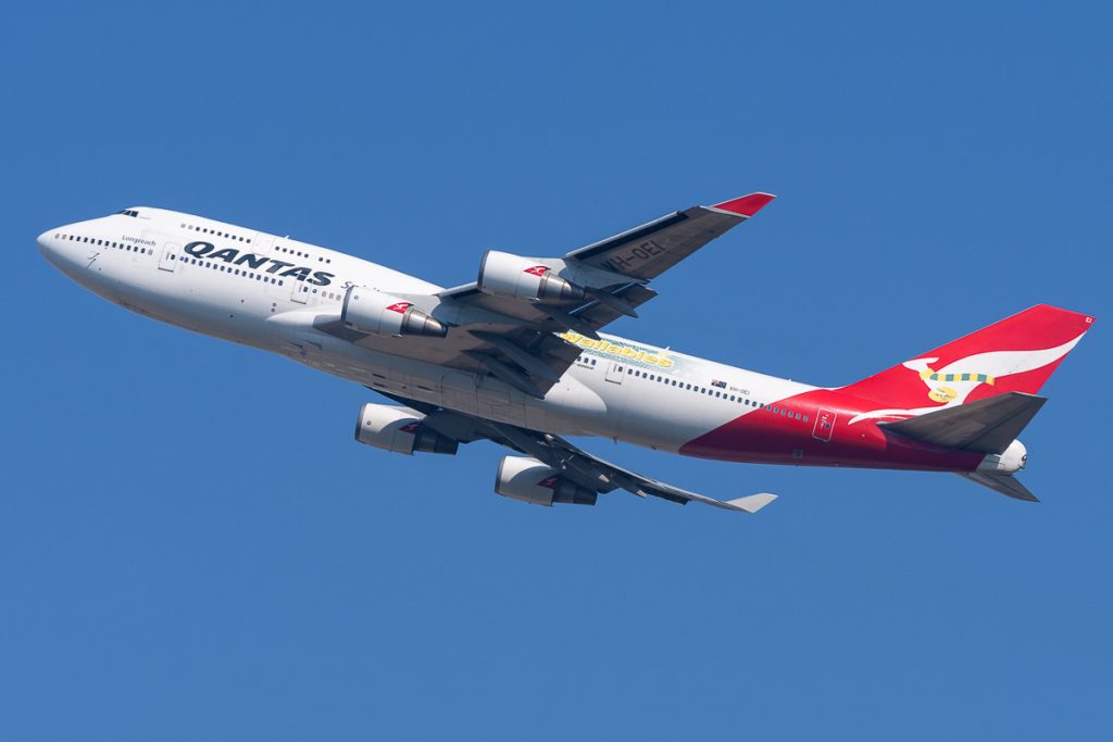 Qantas Boeing 747-438(ER) VH-OEI takes off from YBBN as flight QF2903, a flight to view the Antarctic continent.