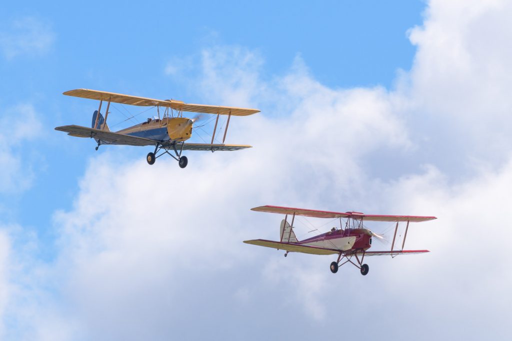 De Havilland DH.82A Tiger Moths VH-BJE and VH-UXD in flight at TAVAS GWFD 2018.