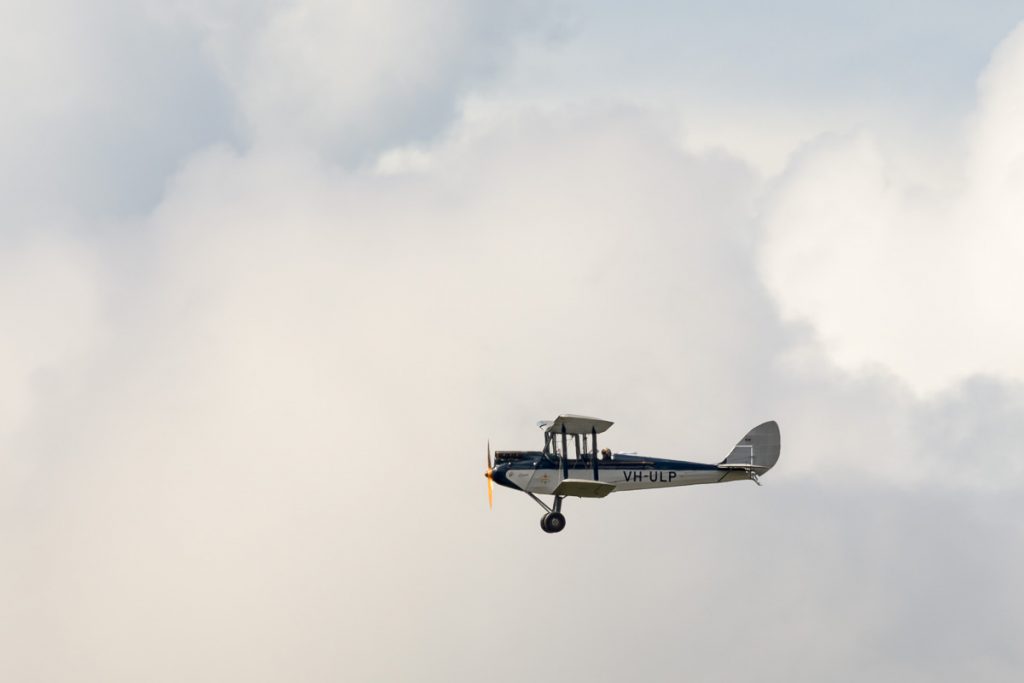 De Havilland DH.60M Moth VH-ULP in flight with some storm clouds brewing at TAVAS GWFD 2018.