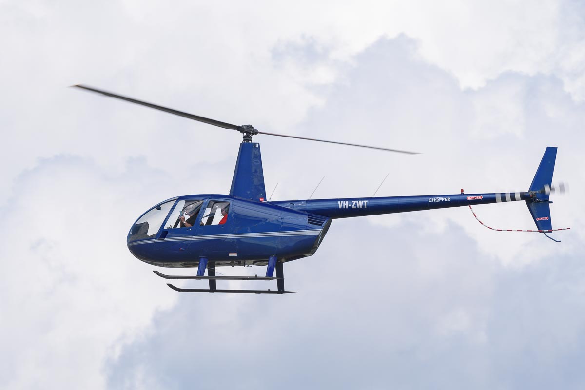 Robinson R44 Raven VH-ZWT in flight at TAVAS GWFD 2018.