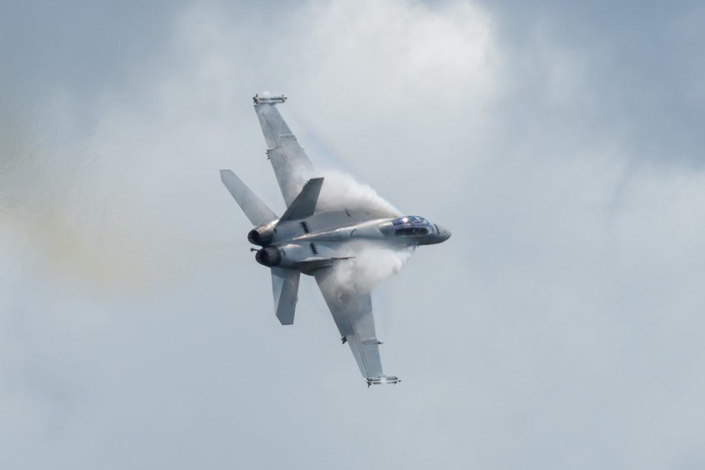 Boeing F/A-18F Super Hornet A44-221 of 1SQN RAAF performing its flying display at TAVAS GWFD 2018. Condensation sheets are forming on wing leading edges.