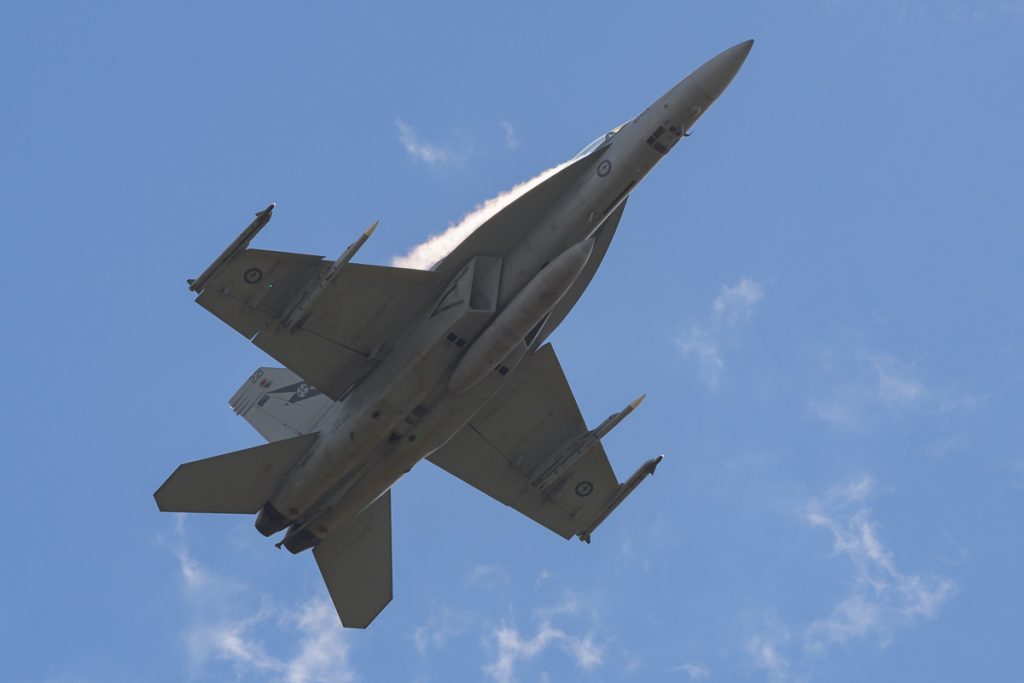 Boeing F/A-18F Super Hornet A44-221 of 1SQN RAAF performing its flying display at TAVAS GWFD 2018. Condensation sheets are forming on wing leading edges.