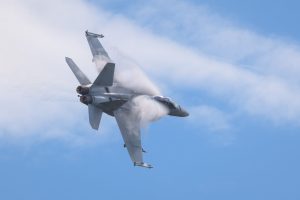 Boeing F/A-18F Super Hornet A44-221 of 1SQN RAAF performing its flying display at TAVAS GWFD 2018. Condensation sheets are forming on wing leading edges.