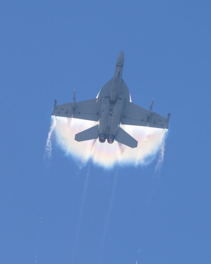 Boeing F/A-18F Super Hornet A44-221 of 1SQN RAAF performing its flying display at TAVAS GWFD 2018. Condensation sheets are forming on wings.