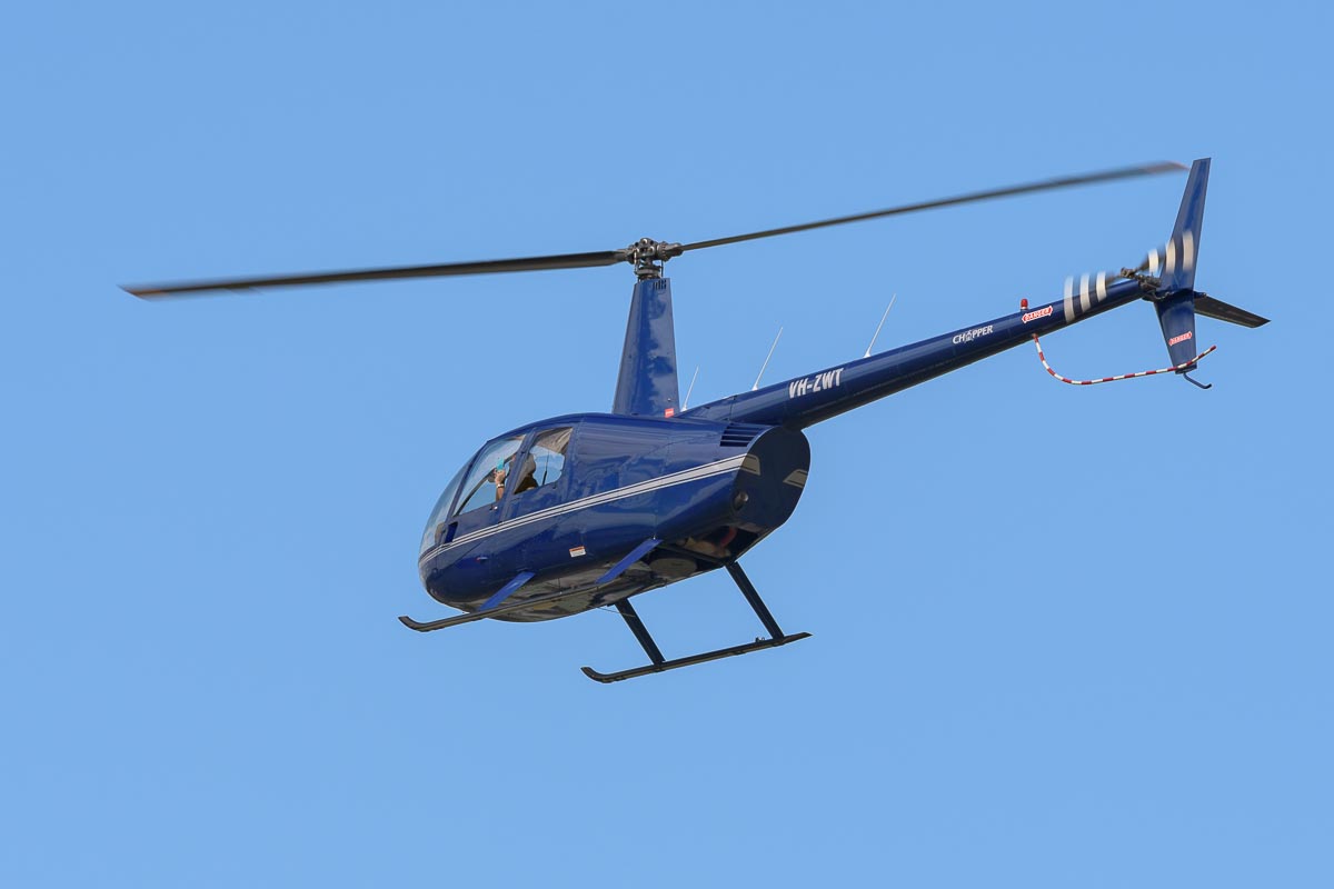 Robinson R44 Raven VH-ZWT in flight at TAVAS GWFD 2018.