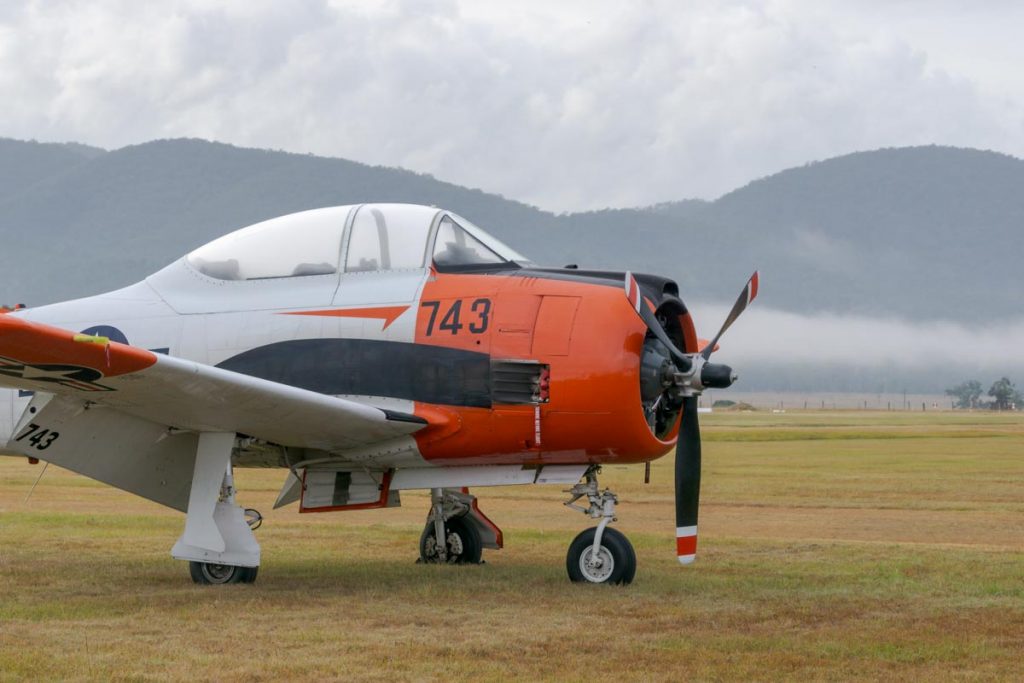North American T-28B Trojan VH-RPX "Miss Stress" in a foggy sunrise at Red Thunder 2018 airshow.