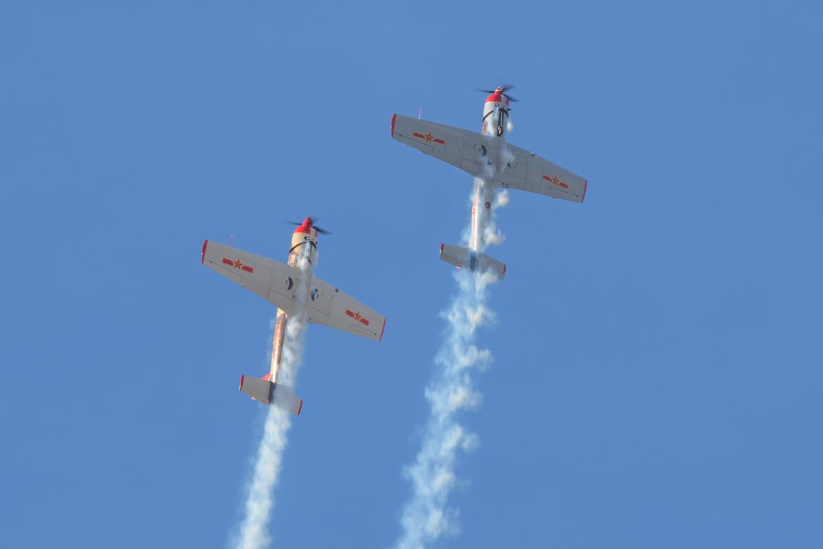 Nanchang CJ-6A VH-CJX "China Doll" and VH-NNG "Madam Chang" performing an aerobatic display.