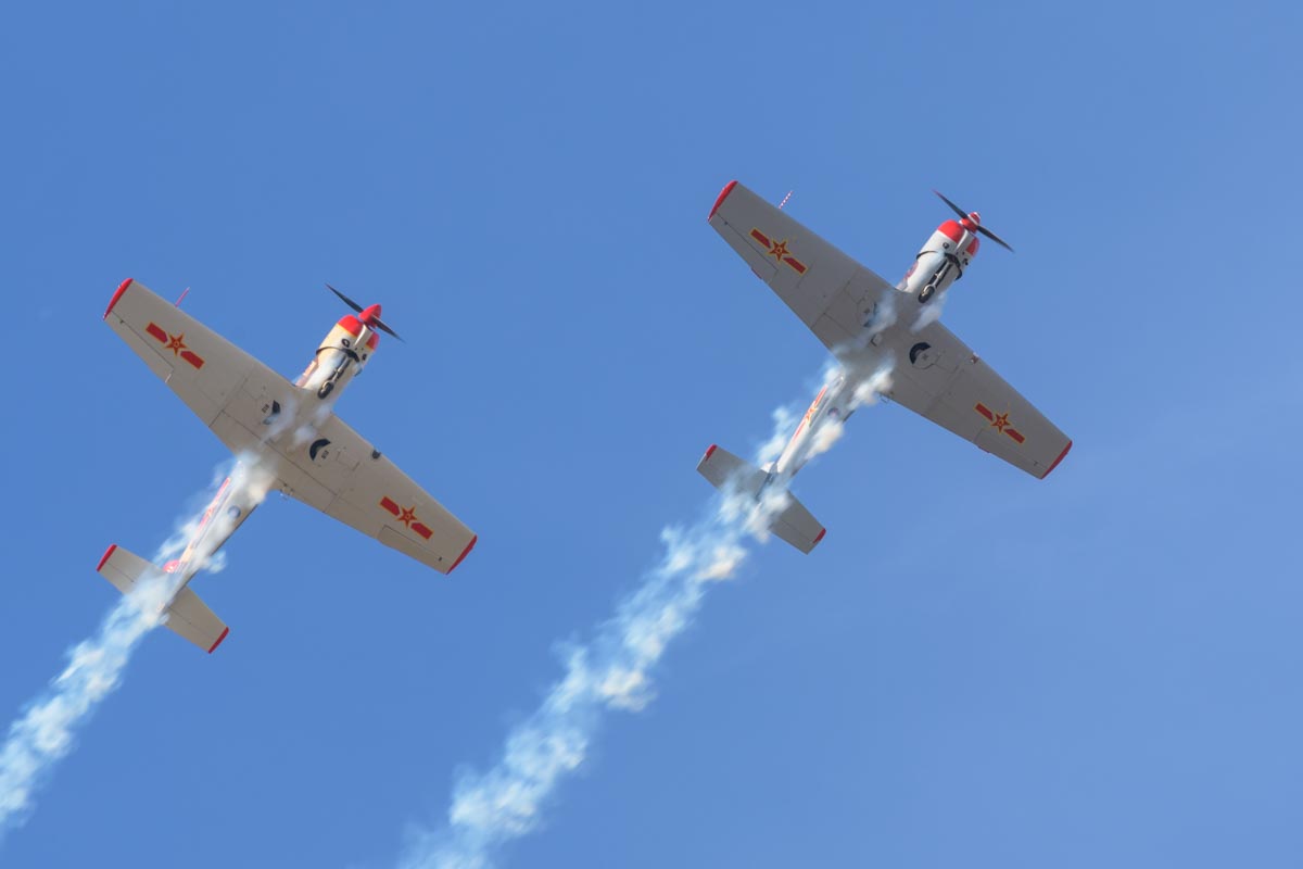 Nanchang CJ-6A VH-CJX "China Doll" and VH-NNG "Madam Chang" performing an aerobatic display.