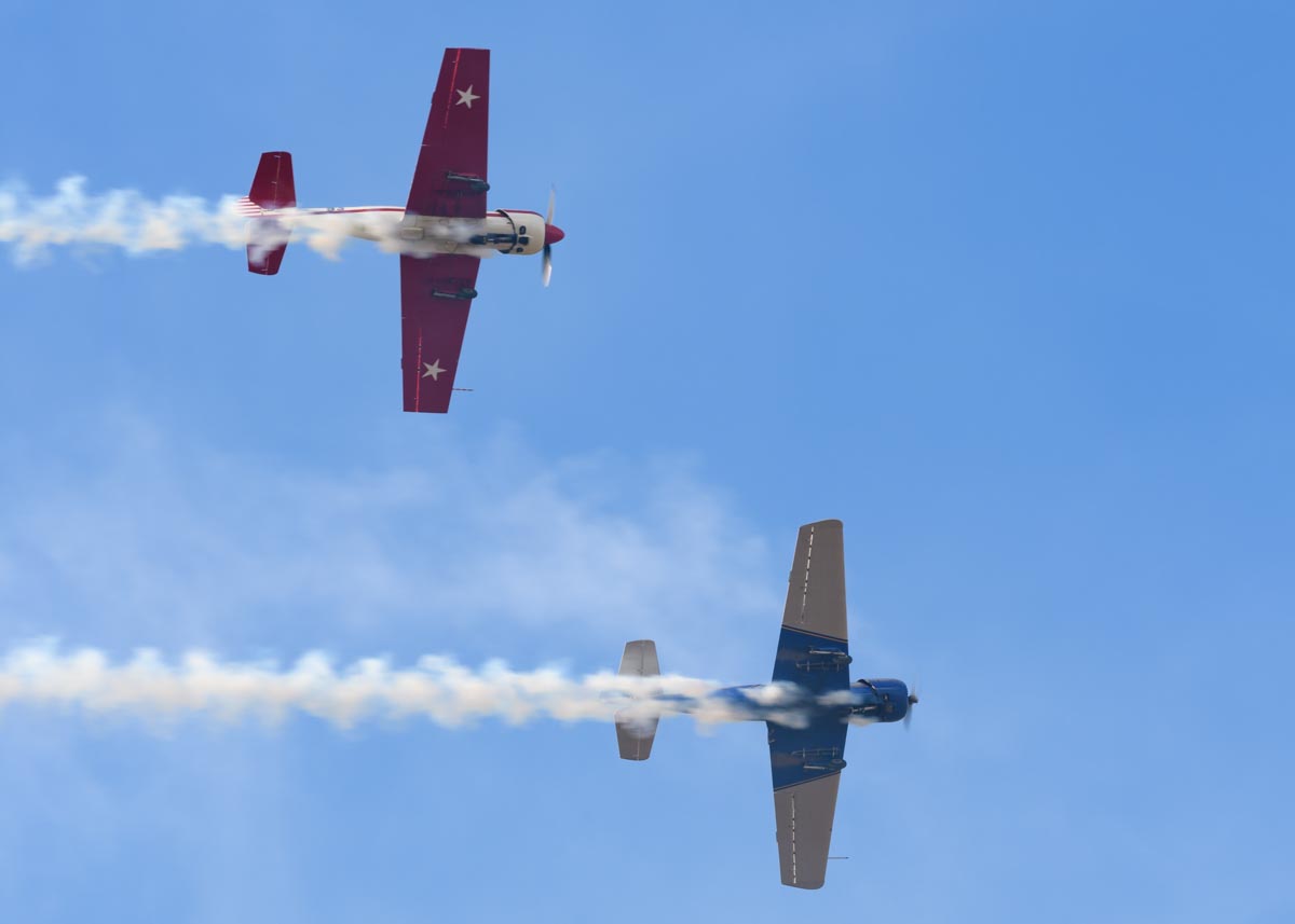 Yakovlev Yak-52s VH-VMI "Vodka Blue" and VH-YYK performing their aerobatic display at Red Thunder 2018 airshow.
