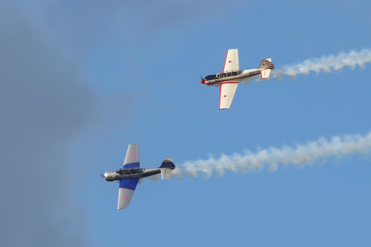 Yakovlev Yak-52s VH-VMI "Vodka Blue" and VH-YYK performing their aerobatic display at Red Thunder 2018 airshow.
