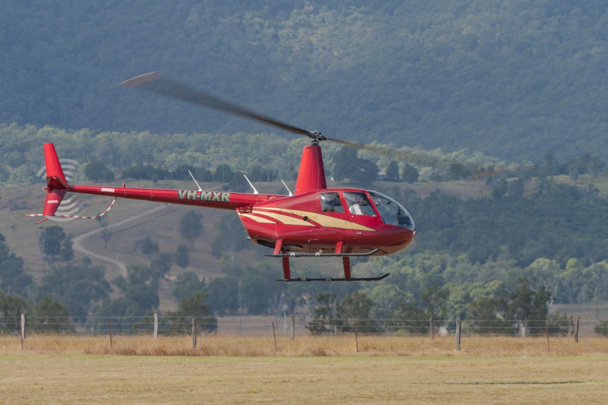 Robinson R44 VH-MXR in flight at Red Thunder 2018 airshow.