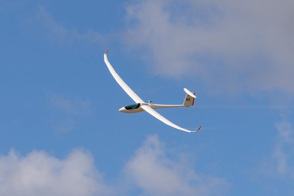 Jonker JS1C glider VH-GAG in flight at Red Thunder 2018 airshow. The small gas turbine engine is visible behind the canopy.