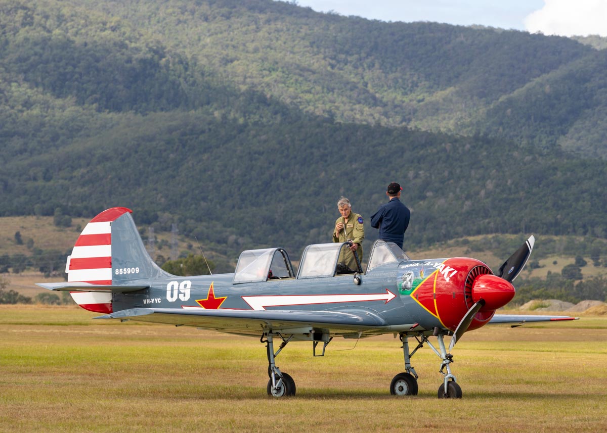 Pilot Peter Scott speaking with another pilot on his Yakovlev Yak-52 trainer VH-YYC "Crack-A-Yak" at Red Thunder 2018 airshow.