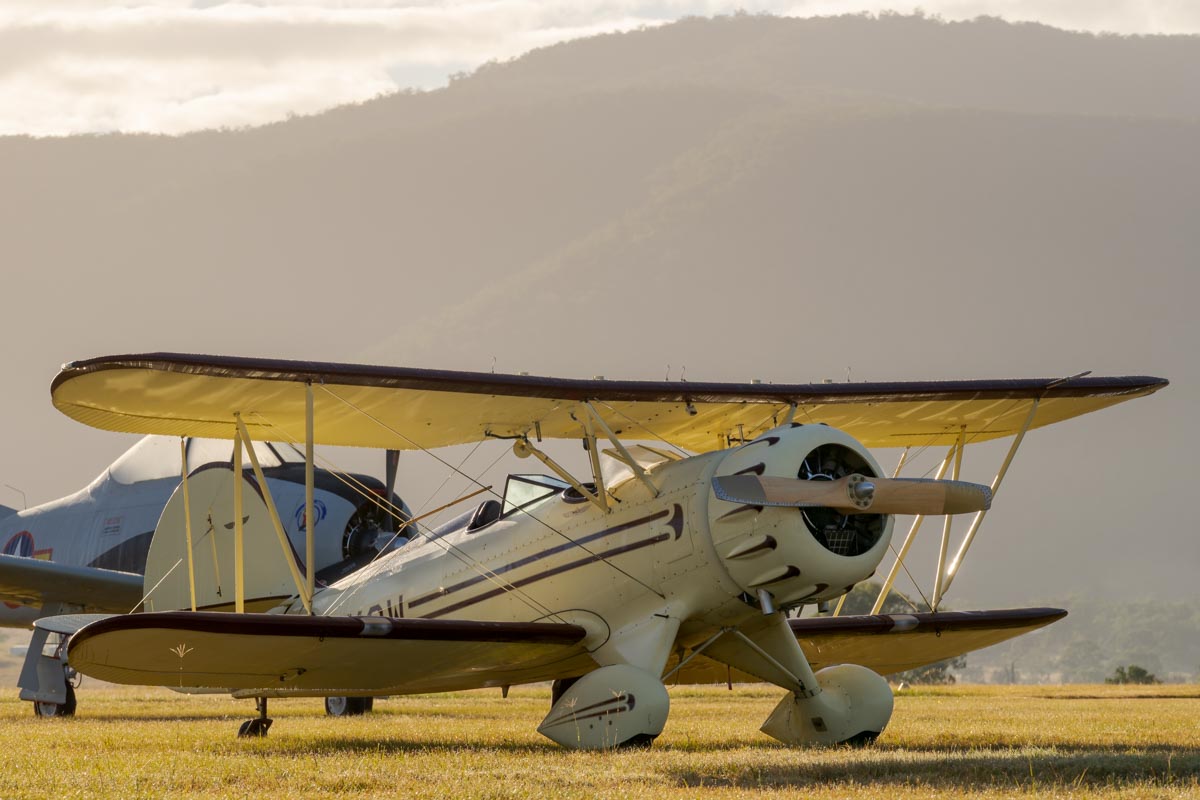 Waco YMF-5C biplane VH-YOW at sunrise.