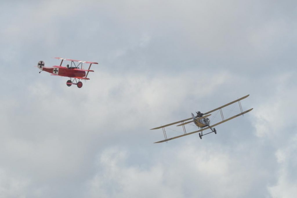 Fokker DR.I VH-FXP and Bristol F.2B VH-IIZ staging a mock dogfight to re-enact the shooting down of the Red Baron at Red Thunder 2018 airshow.