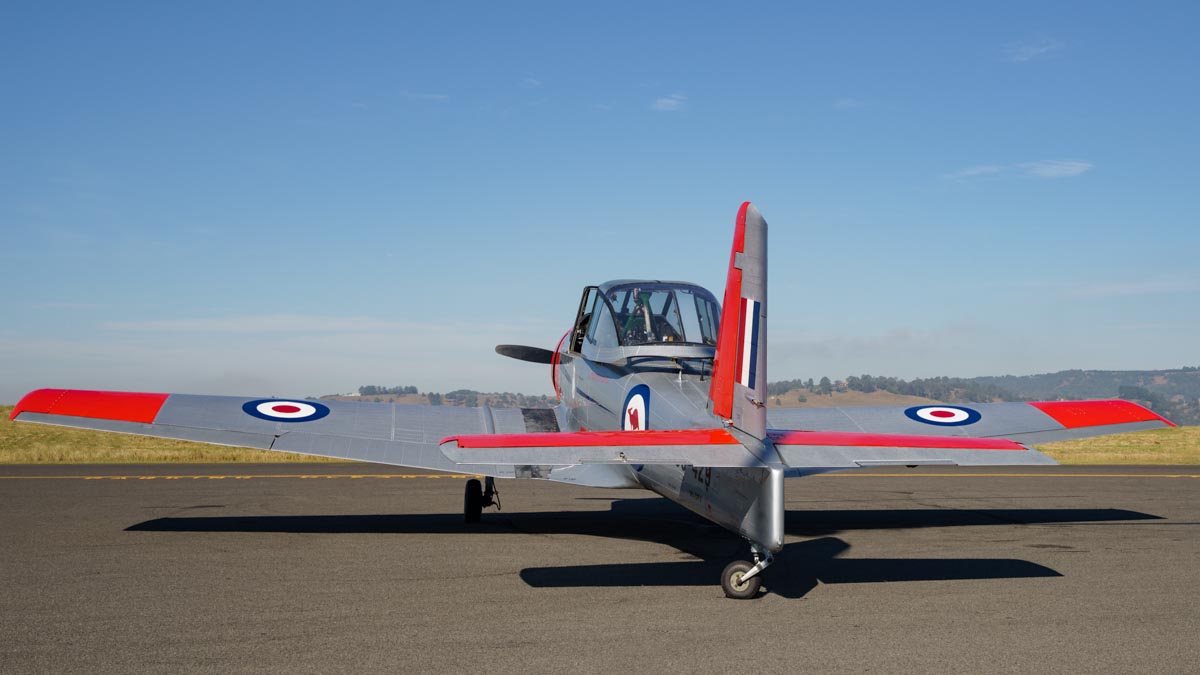 Low angle tail shot of CAC CA-25 Winjeel VH-OPJ parked at the Lismore Aviation Expo 2018 airshow.