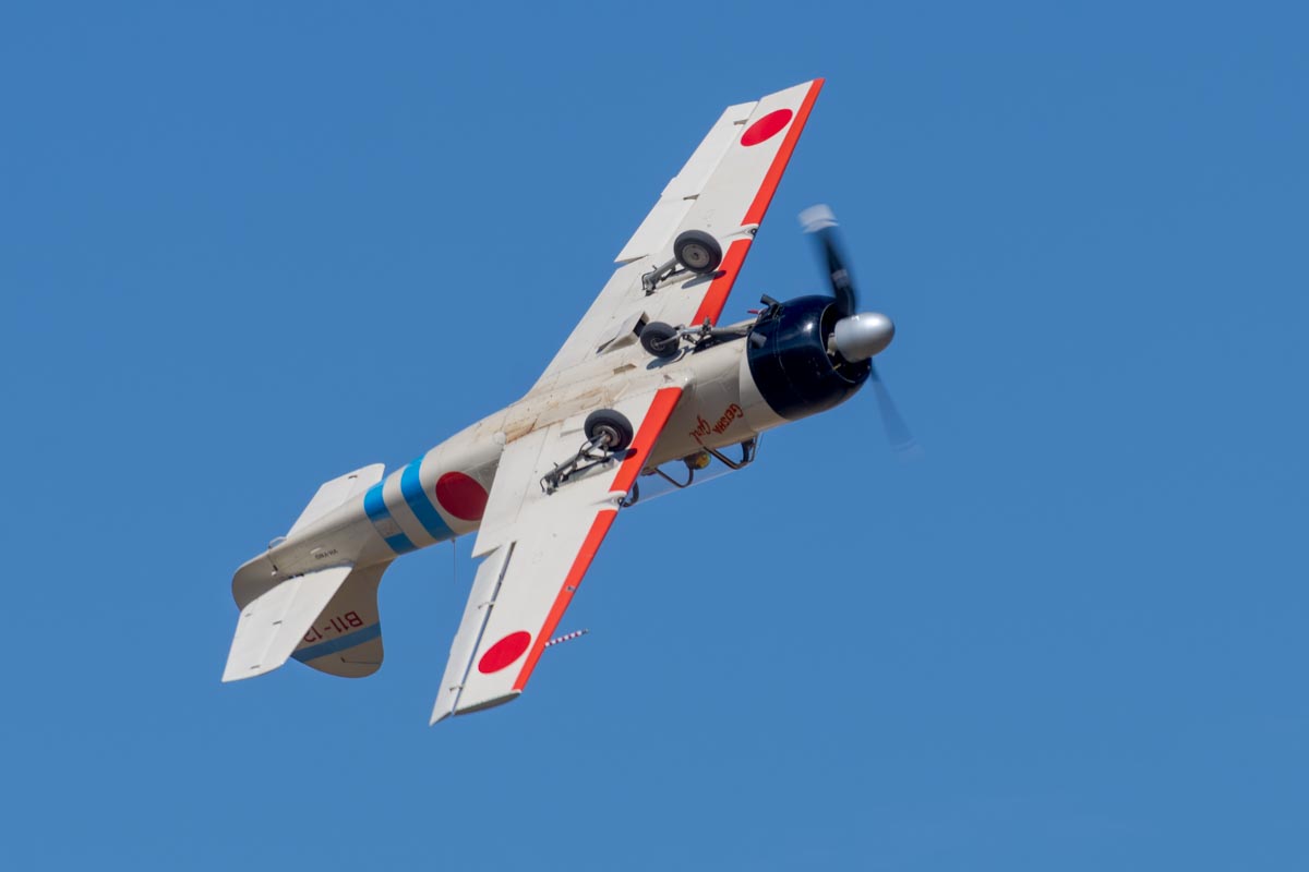 Yakovlev Yak-52 VH-YNO "Geisha Girl" inverted during its flying display at the Lismore Aviation Expo 2018 airshow.