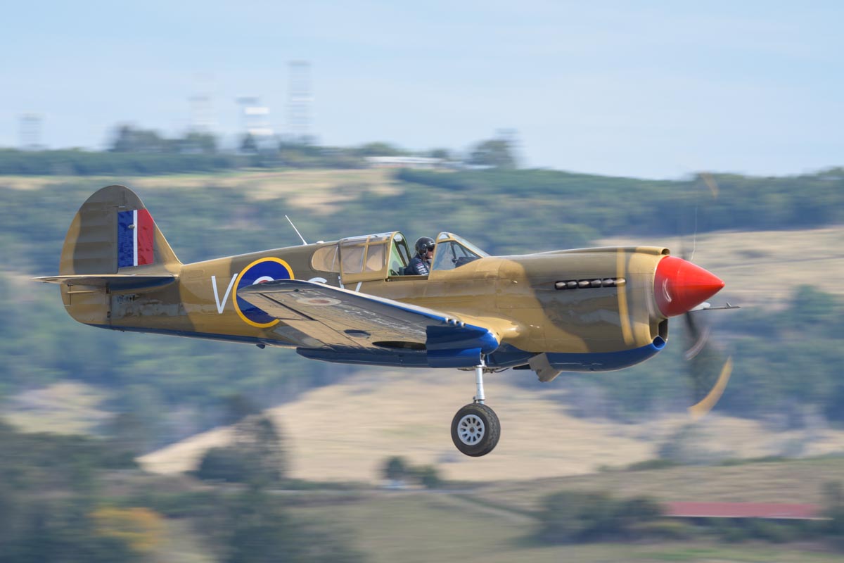 Curtiss P-40E Kittyhawk Mk IA VH-KTY takes off with undercarriage still retracting at the Lismore Aviation Expo 2018 airshow.