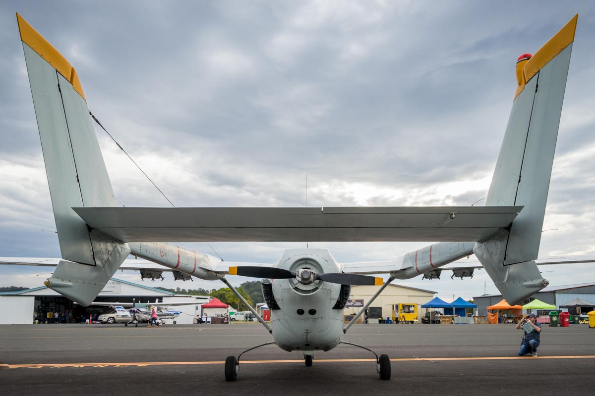 Rear view between the twin tail booms of Cessna O-2A Skymaster VH-OTO at the Lismore Aviation Expo 2018 airshow.