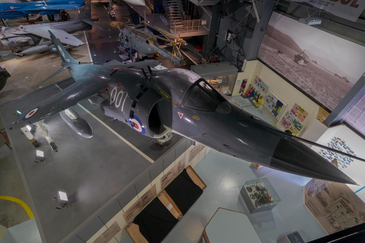 Hawker-Siddeley Sea Harrier FRS.1 XZ493 displayed as about to lift off from an aircraft carrier ski jump ramp at the Royal Navy Fleet Air Arm Museum.