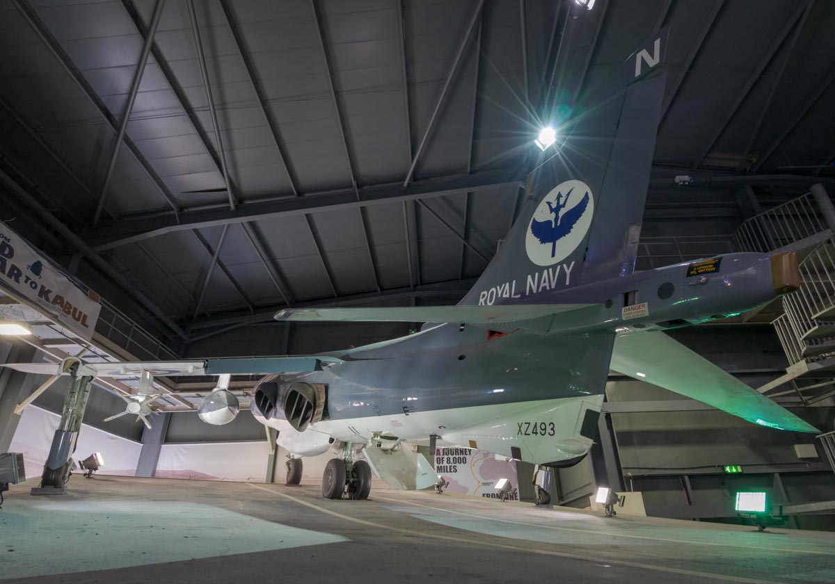 Hawker-Siddeley Sea Harrier FRS.1 XZ493 displayed as about to lift off from an aircraft carrier ski jump ramp at the Royal Navy Fleet Air Arm Museum.