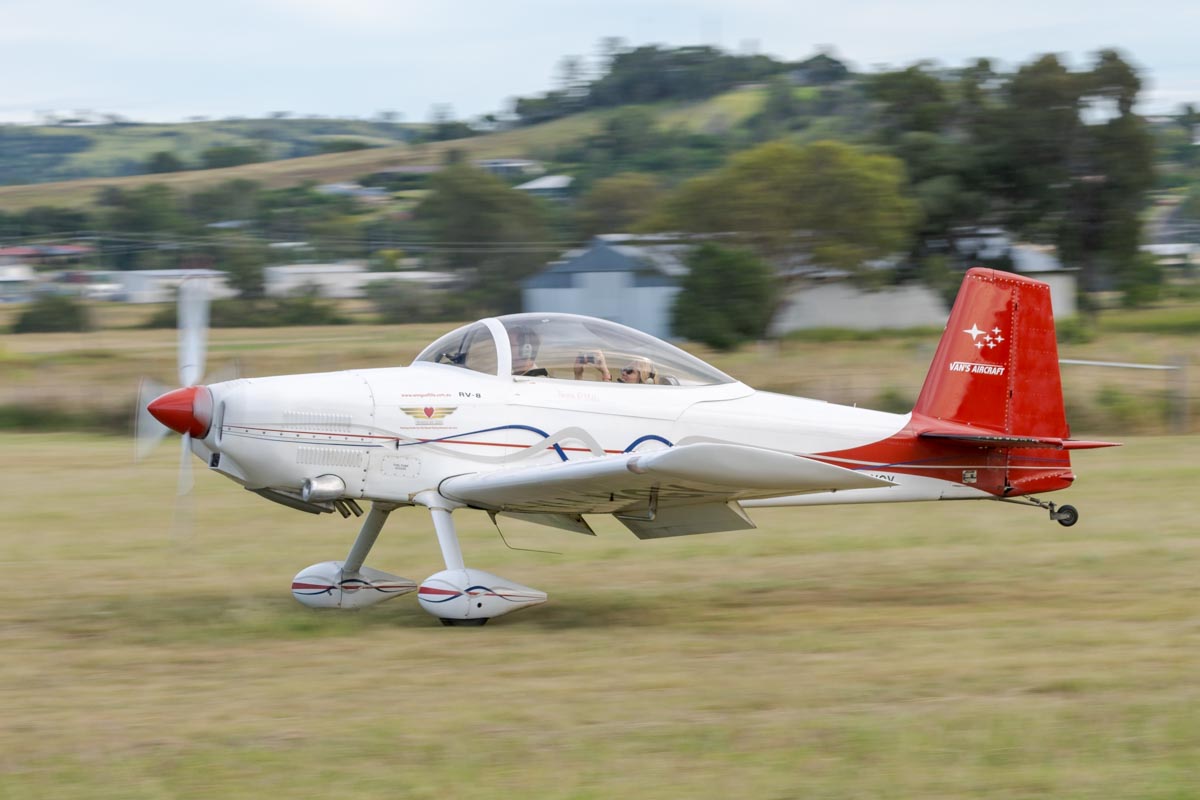 Vans RV-8 VH-YGY landing at the Airsport Qld breakfast fly-in. The passenger seems to be happy capturing the landing on video.