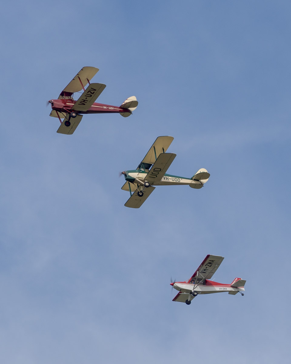 De Havilland DH.82 Tiger Moth, Genairco Biplane and Rans S-7 Courier VH-UZV VH-UOD VH-ZMA in formation after takeoff from the Airsport Qld breakfast fly-in.