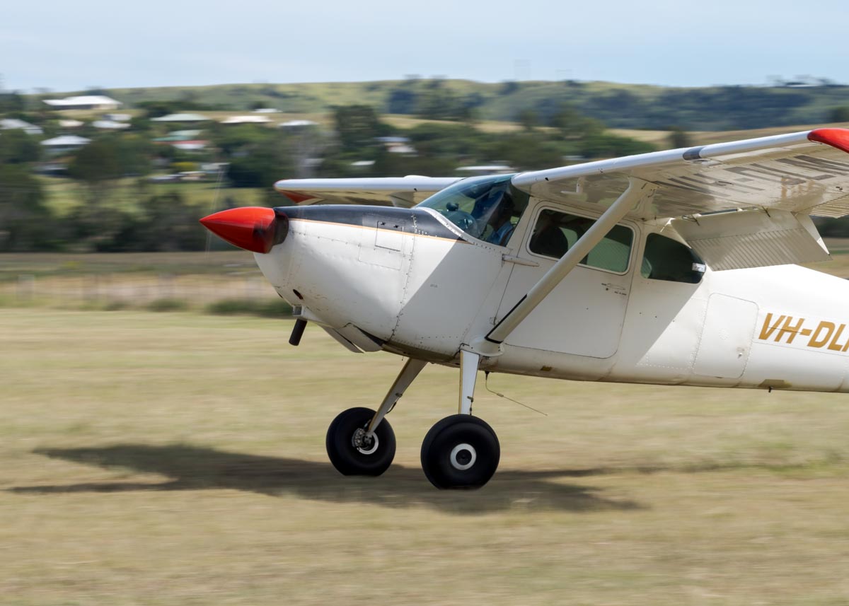 Cessna 180A VH-DLM landing at the Airsport Qld breakfast fly-in.