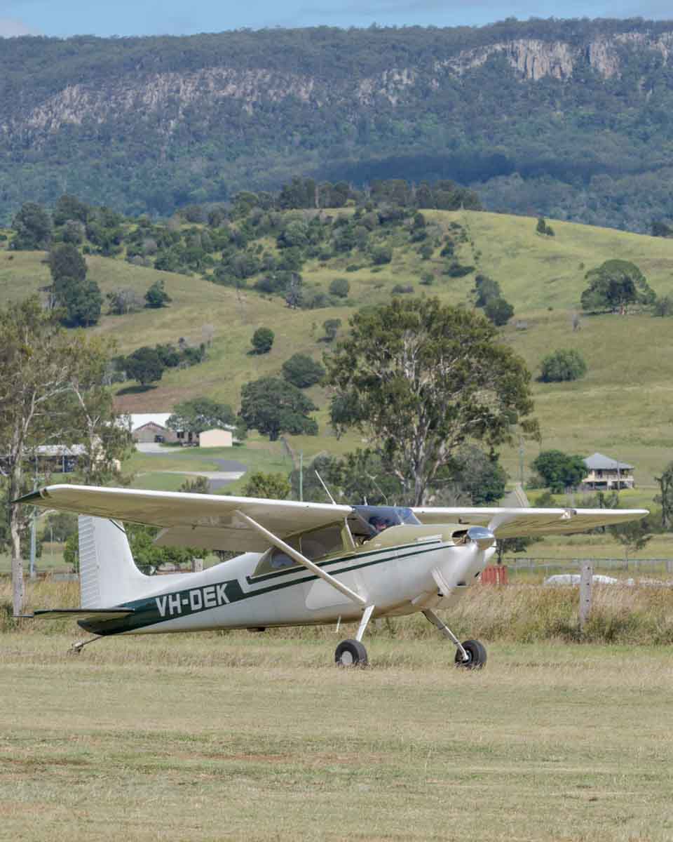 Cessna 180A VH-DEK taxiing at the Airsport Qld breakfast fly-in.