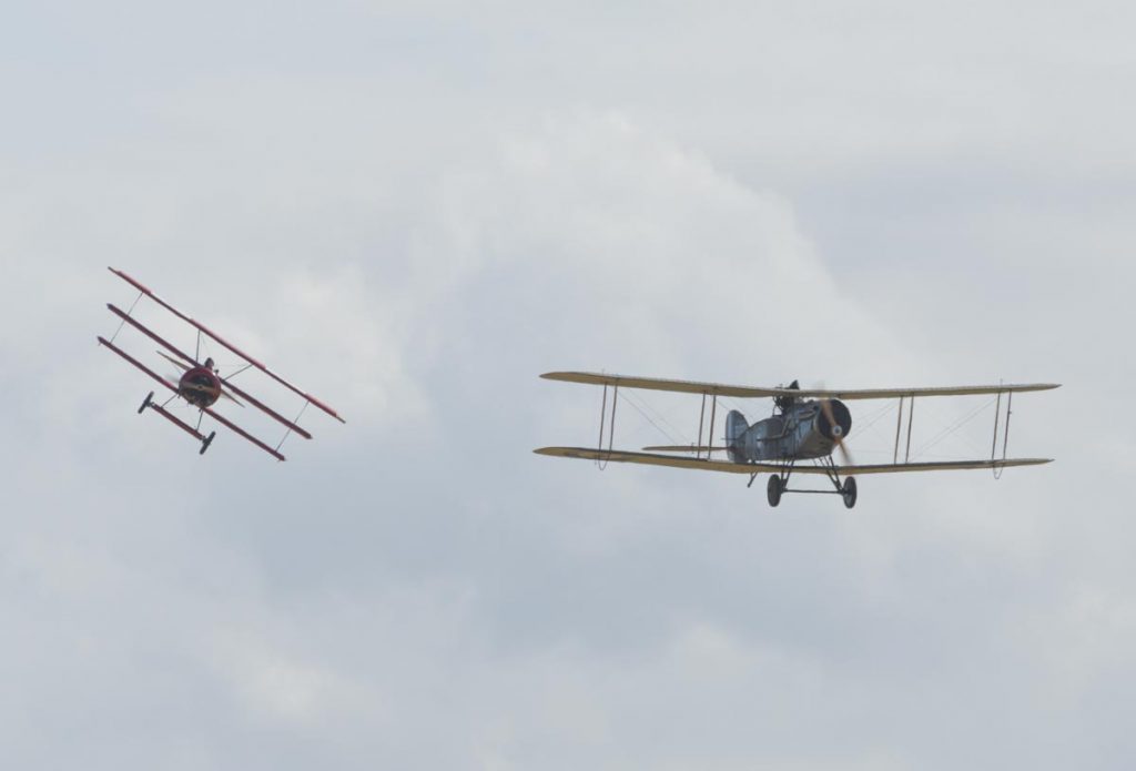 Fokker DR.I VH-FXP and Bristol F.2B VH-IIZ staging a mock dogfight to re-enact the shooting down of the Red Baron at Red Thunder 2018 airshow.
