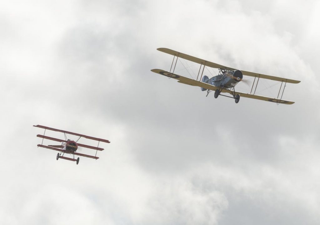Fokker DR.I VH-FXP and Bristol F.2B VH-IIZ staging a mock dogfight to re-enact the shooting down of the Red Baron at Red Thunder 2018 airshow.