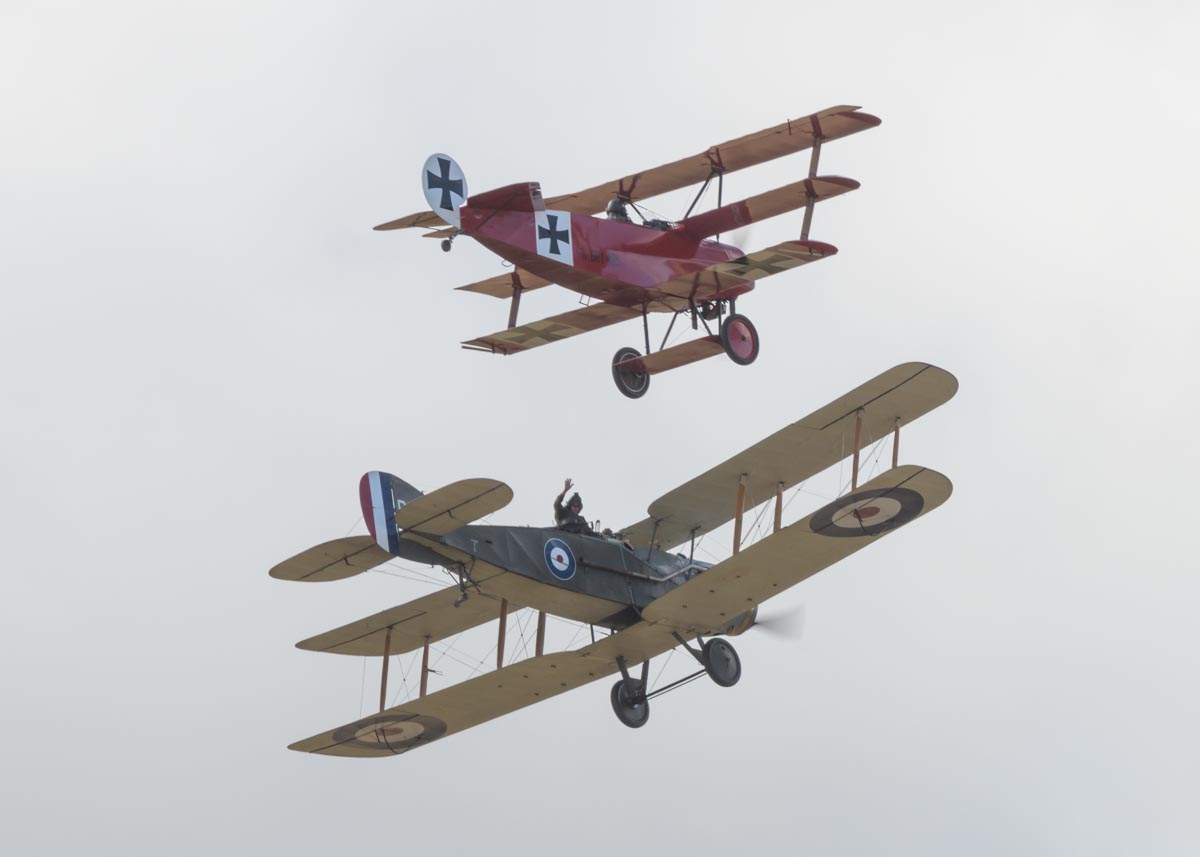 Fokker DR.I VH-FXP and Bristol F.2B VH-IIZ staging a mock dogfight to re-enact the shooting down of the Red Baron at Red Thunder 2018 airshow.